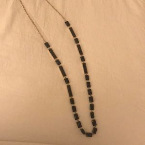 Long gold and black bead necklace
